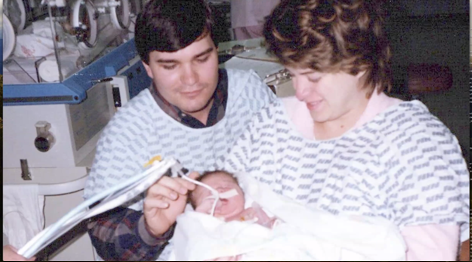 Photo of Heather Rose and parents in the hospital after Heather was born